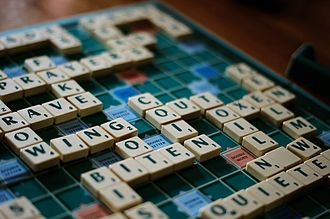 Scrabble board with tiles.
